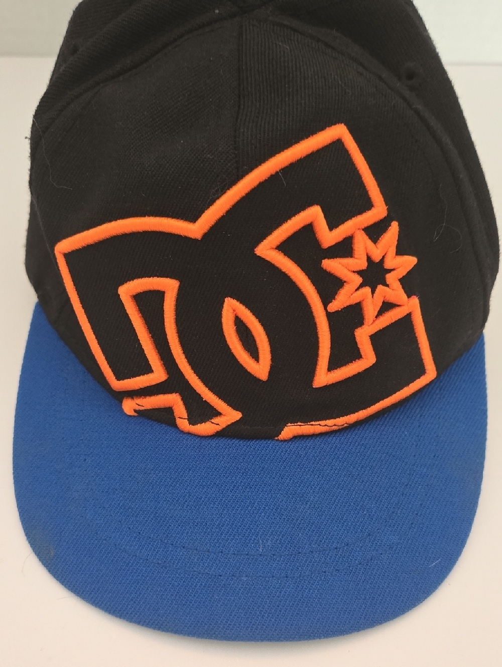 DC Kids Black Hat with Blue Visor and Orange Logo